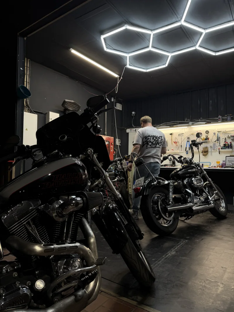 Motorcycles in the Courage Garage workshop.